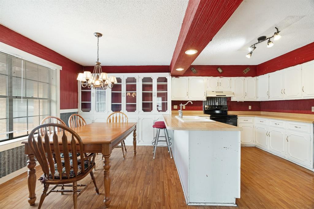 595 County Road Powderly, TX 75473 - Photo 6 of 25 a dining room with furniture and wooden floor