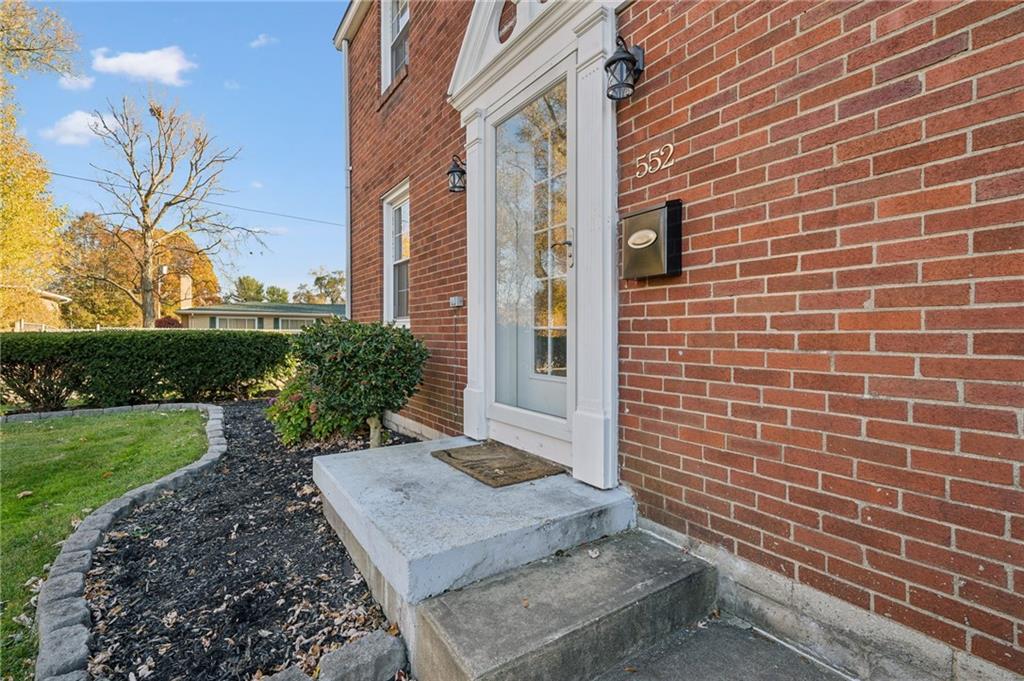 552 Hampton Street Greensburg, PA 15601 - Photo 11 of 36 a view of a brick house with a yard