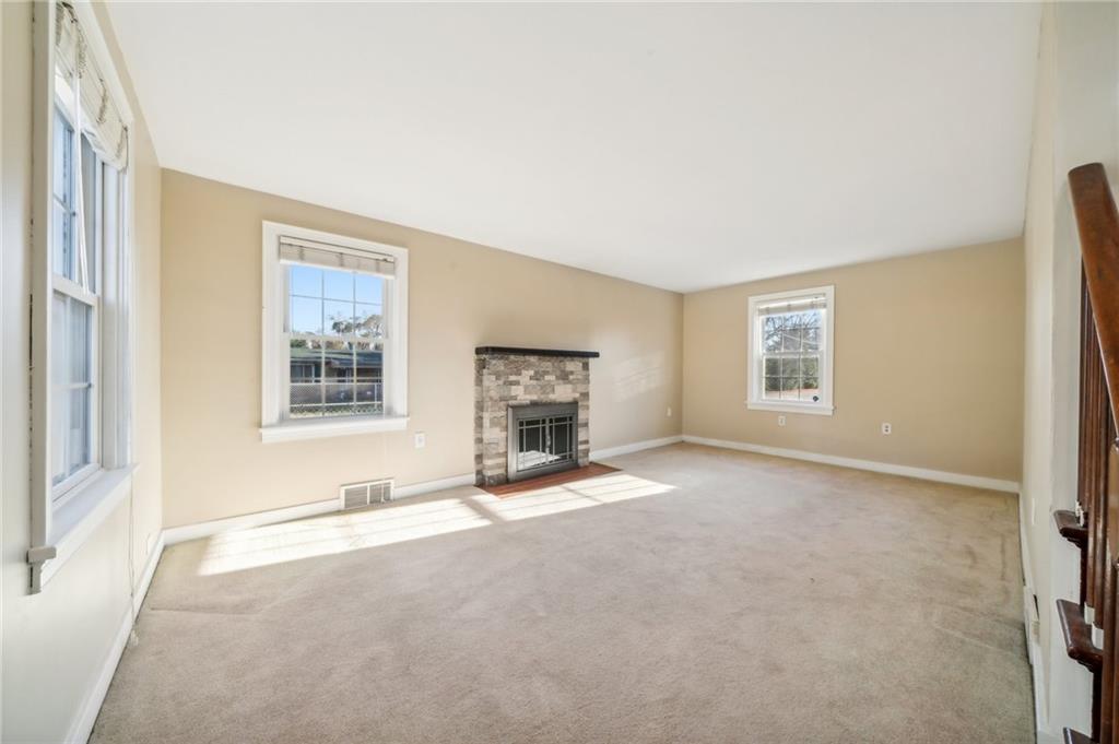 552 Hampton Street Greensburg, PA 15601 - Photo 12 of 36 an empty room with windows and fireplace