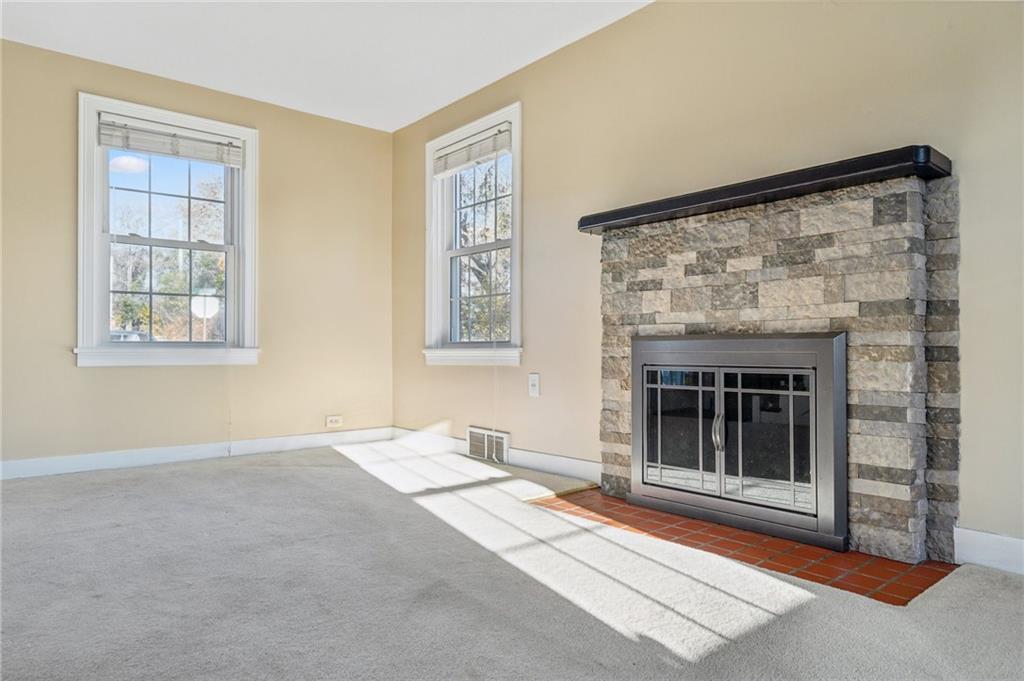 552 Hampton Street Greensburg, PA 15601 - Photo 14 of 36 a view of livingroom with window fireplace and windows