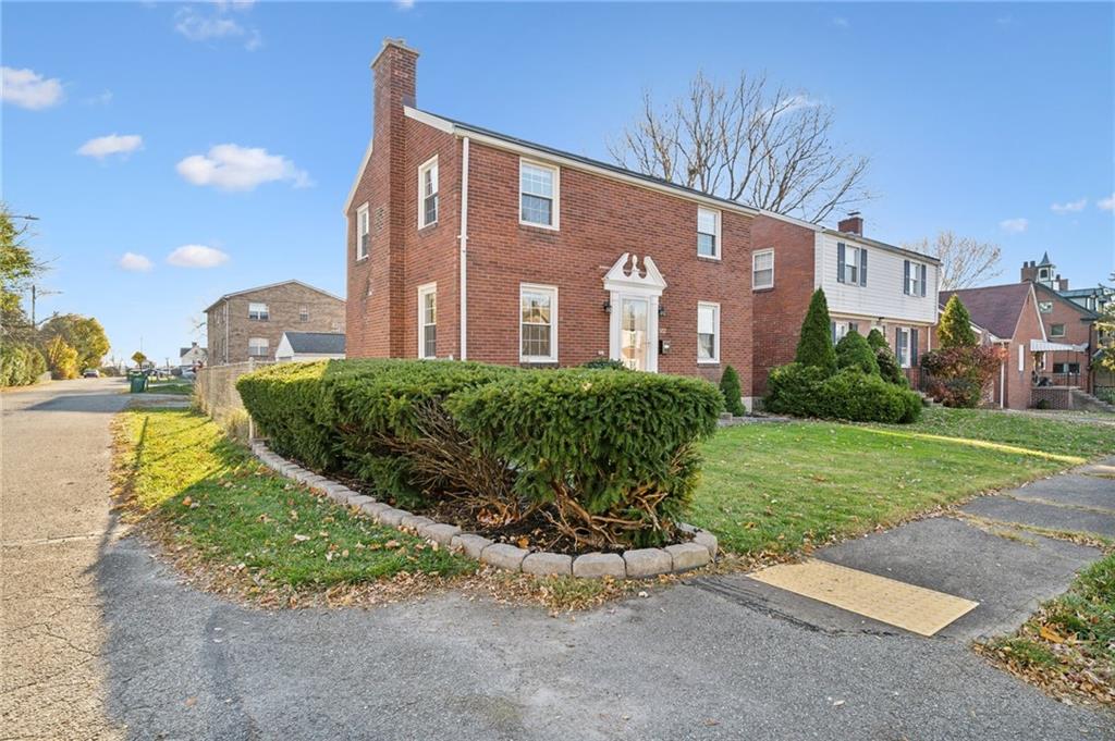 552 Hampton Street Greensburg, PA 15601 - Photo 2 of 36 a front view of a house with garden