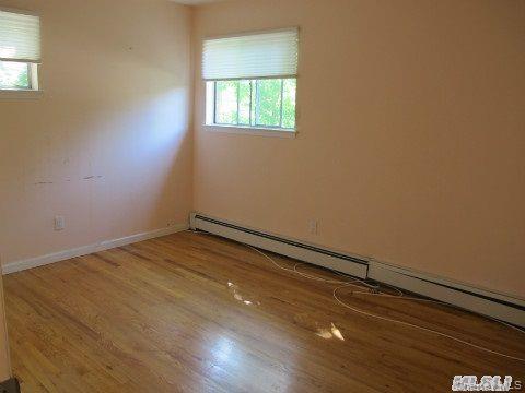 5 Elm Street Great Neck, NY 11021 - Photo 12 of 17 an empty room with a window
