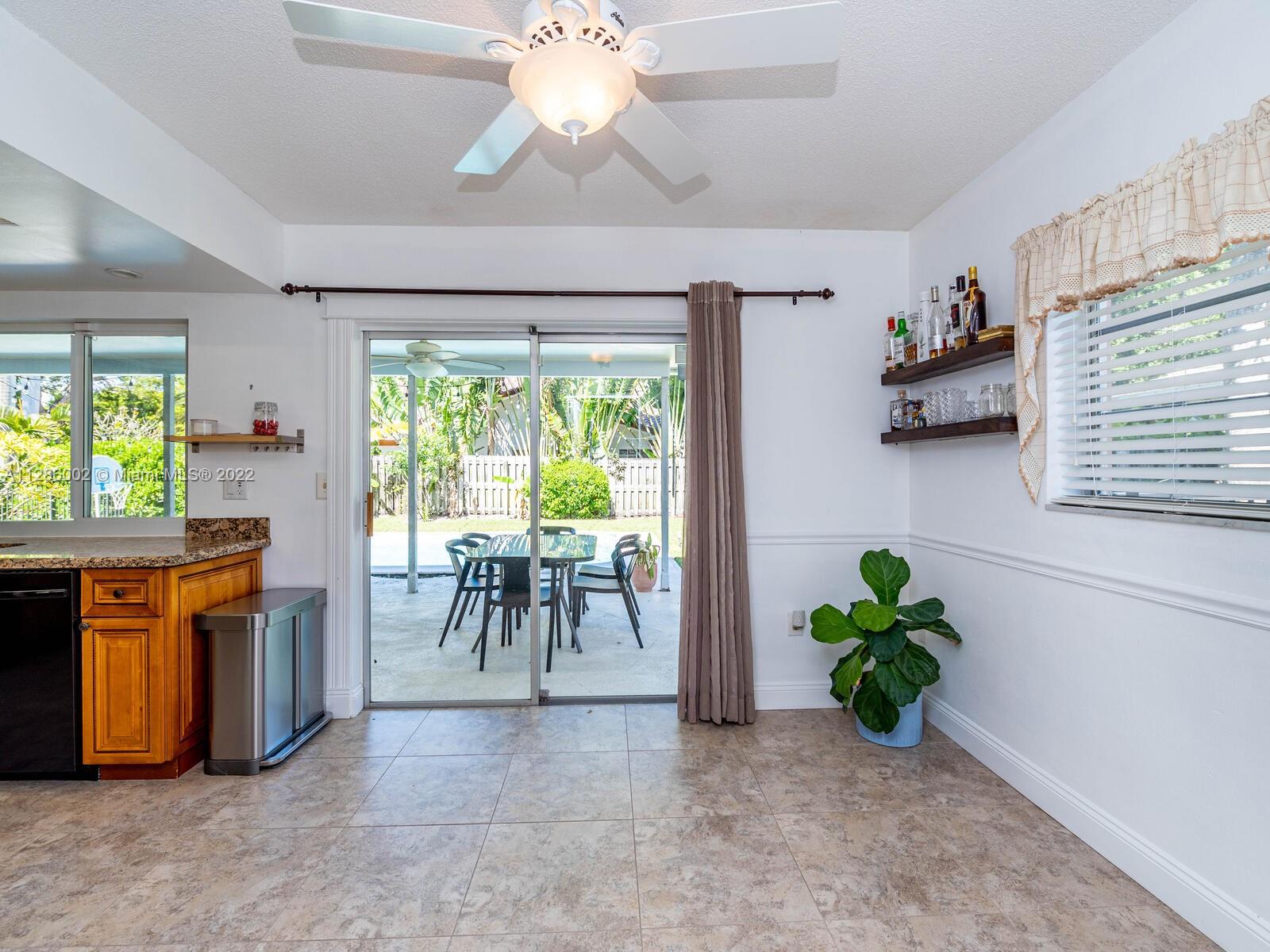 799 Periwinkle Street Boca Raton, FL 33486 - Photo 24 of 55 a view of a dining room with furniture window and outside view