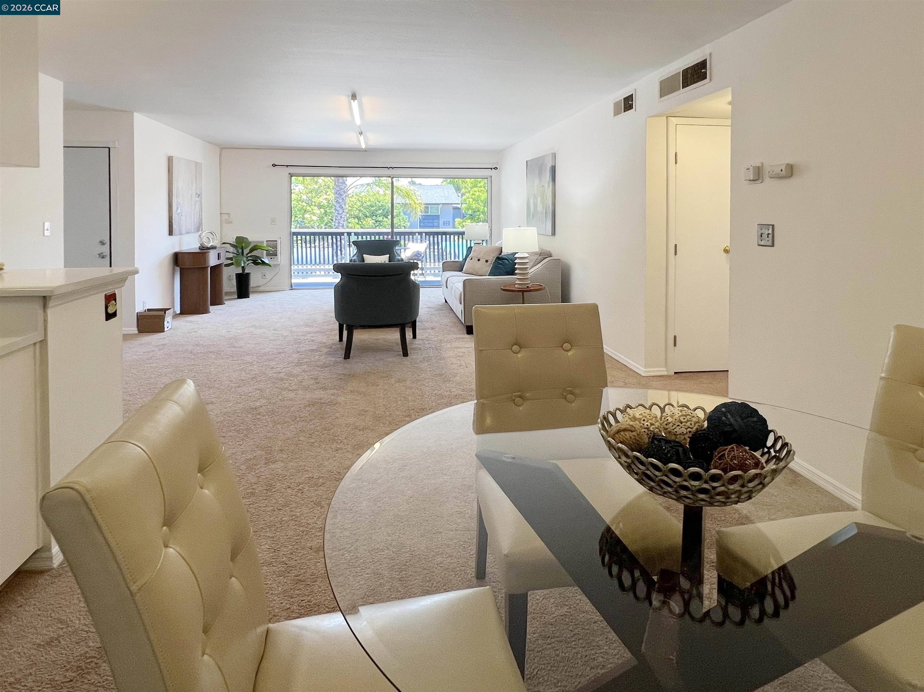 9085 Alcosta Boulevard, Unit 424 San Ramon, CA 94583 - Photo 5 of 21 a living room with furniture and a large window