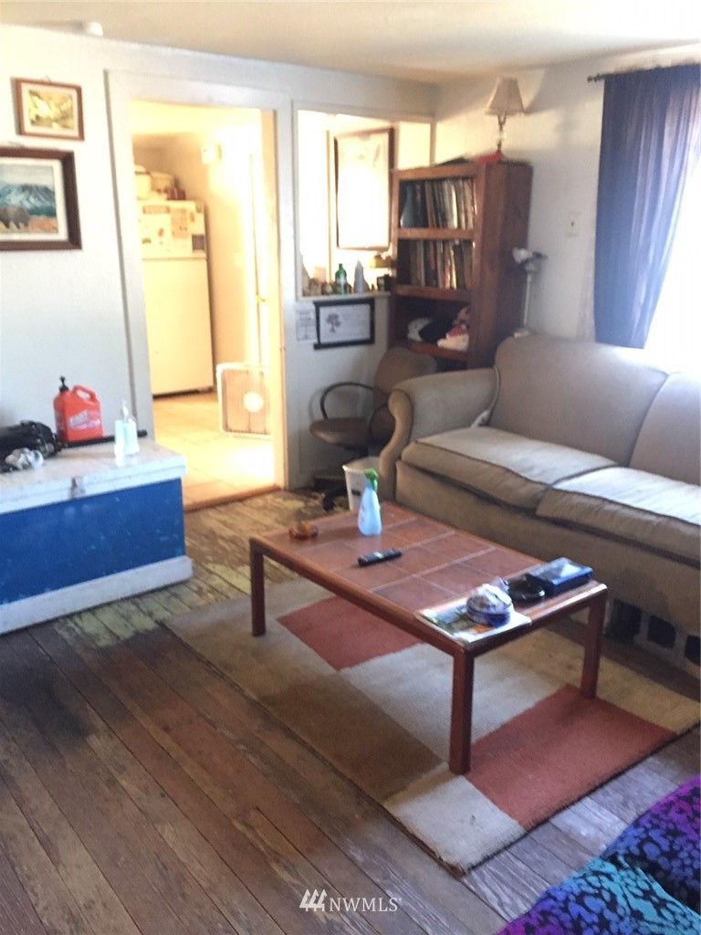 565 McNaught Road South, Unit 1&2 Roy, WA 98580 - Photo 12 of 14 a living room with furniture and a potted plant