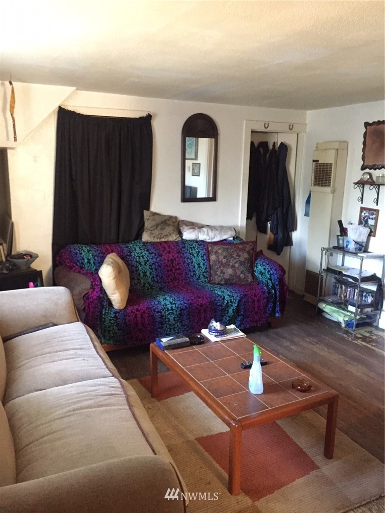 565 McNaught Road South, Unit 1&2 Roy, WA 98580 - Photo 13 of 14 a living room with furniture and a wooden floor