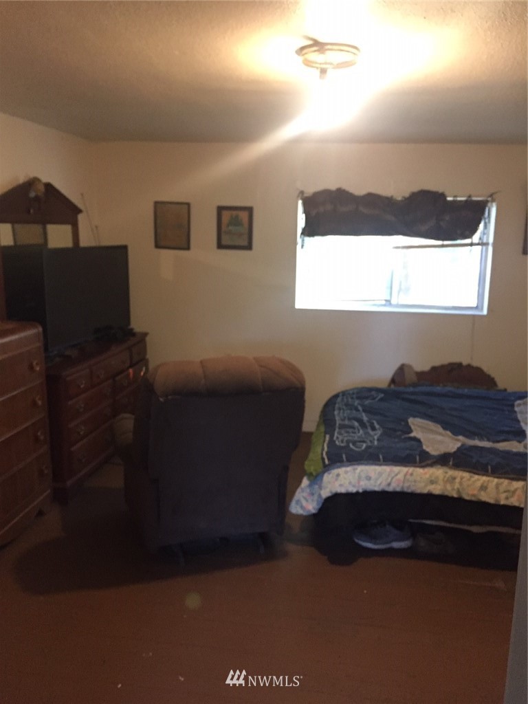 565 McNaught Road South, Unit 1&2 Roy, WA 98580 - Photo 14 of 14 a bedroom with a bed and window