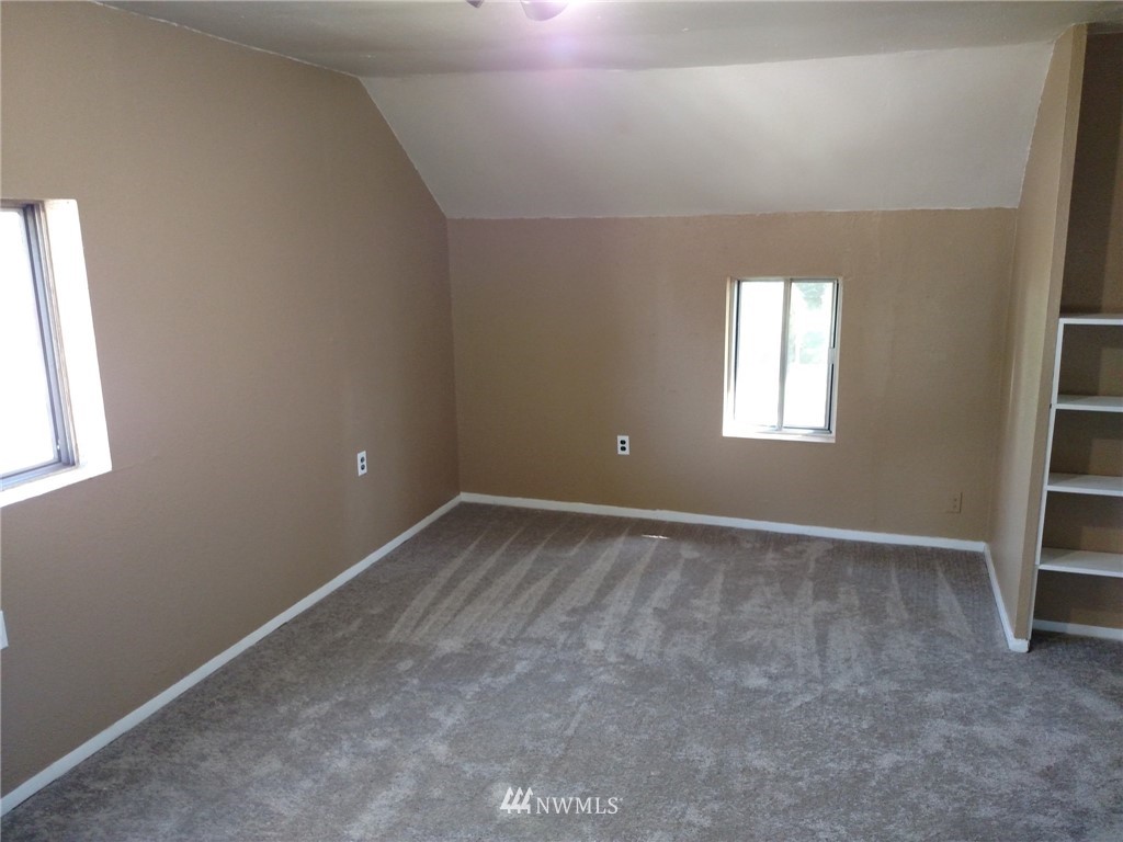 565 McNaught Road South, Unit 1&2 Roy, WA 98580 - Photo 6 of 14 an empty room with windows