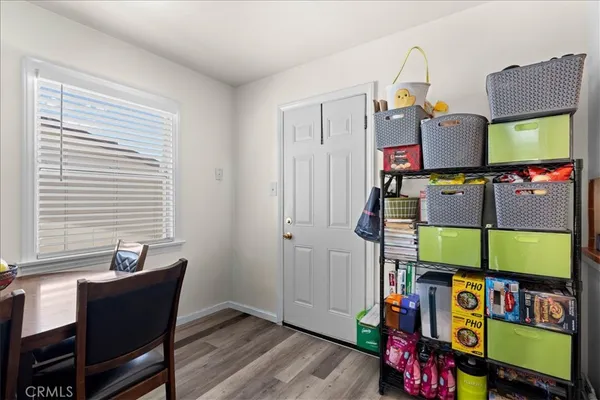 a kitchen with stainless steel appliances granite countertop a sink and a refrigerator