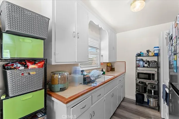 a view of kitchen island with furniture and wooden floor
