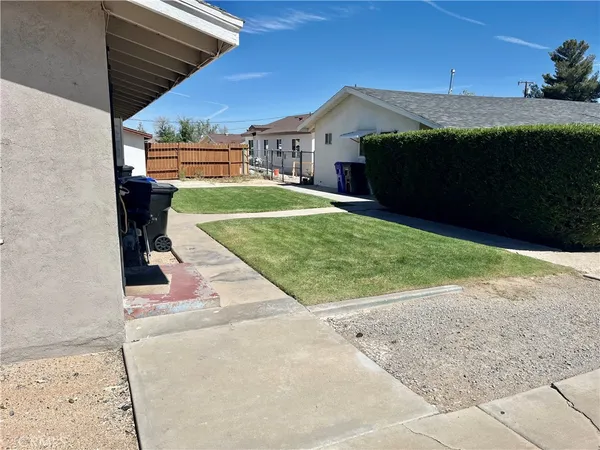 a front view of house with yard and outdoor seating