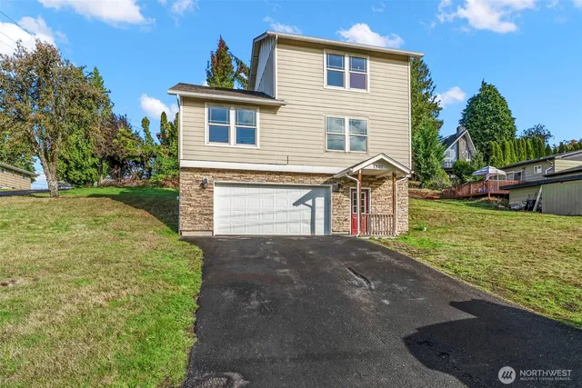 a front view of a house with garden