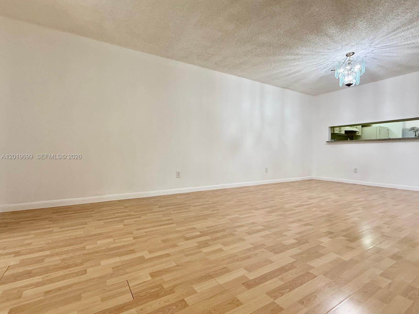 3470 Foxcroft Road, Unit 204 Miramar, FL 33025 - Photo 8 of 40 a view of an empty room with wooden floor