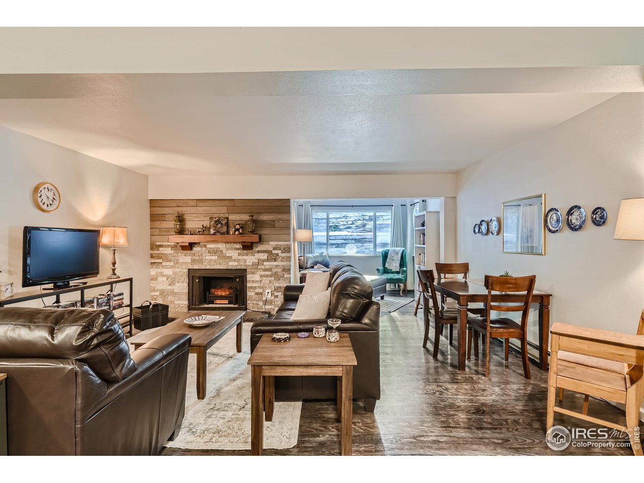 9366 Fall River Road, Unit 208 Idaho Springs, CO 80452 - Photo 2 of 11 Fireplace And Sun Room With Reading Nook