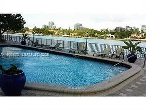 a view of a house with wooden deck and a garden