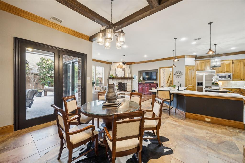 4290 Castle Bank Lane Frisco, TX 75033 - Photo 14 of 40 a view of a dining room with furniture window and wooden floor
