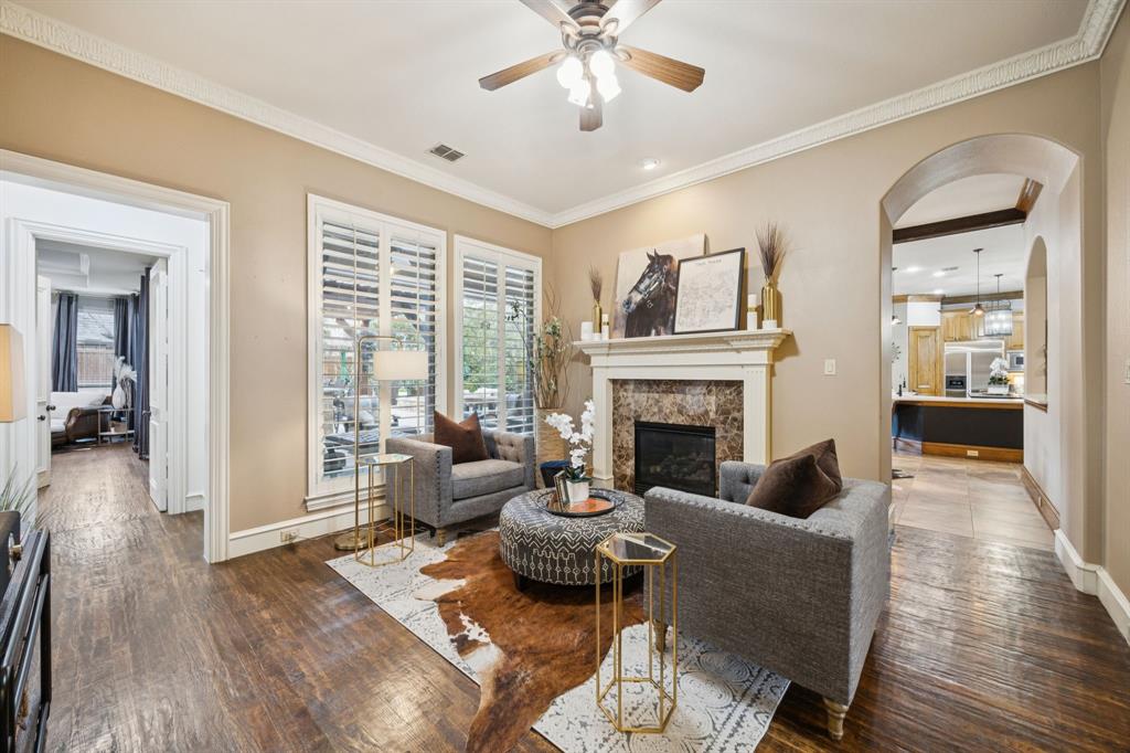 4290 Castle Bank Lane Frisco, TX 75033 - Photo 17 of 40 a living room with furniture and a fireplace