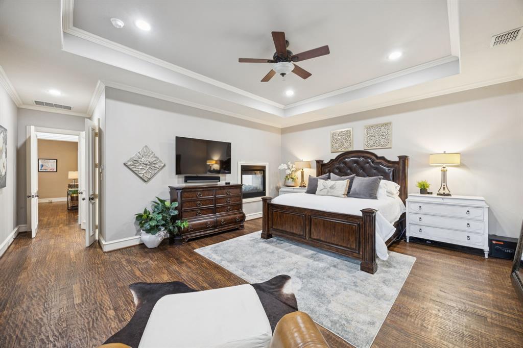 4290 Castle Bank Lane Frisco, TX 75033 - Photo 20 of 40 a bedroom with a bed and a flat screen tv