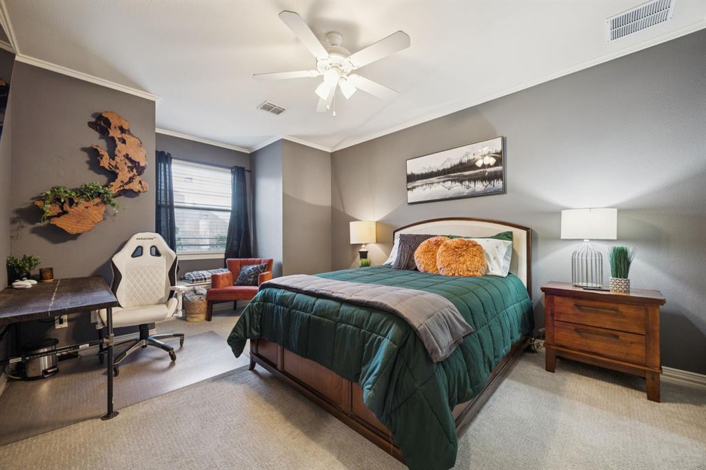 4290 Castle Bank Lane Frisco, TX 75033 - Photo 25 of 40 a bedroom with a bed and dresser