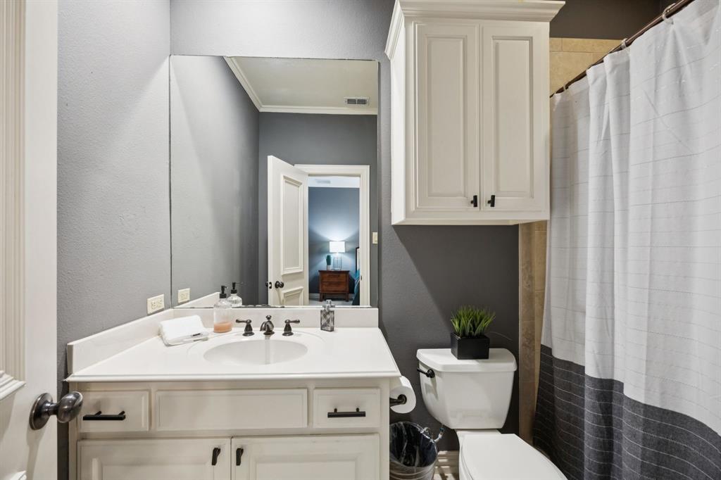 4290 Castle Bank Lane Frisco, TX 75033 - Photo 26 of 40 a bathroom with a sink toilet and mirror