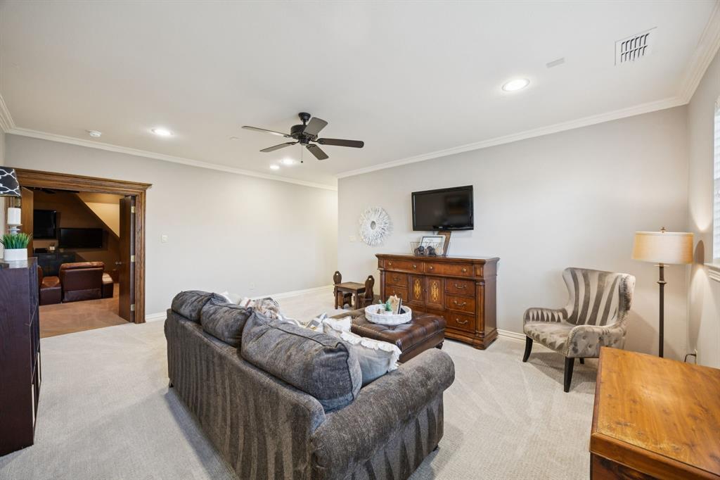 4290 Castle Bank Lane Frisco, TX 75033 - Photo 30 of 40 a living room with furniture and a flat screen tv