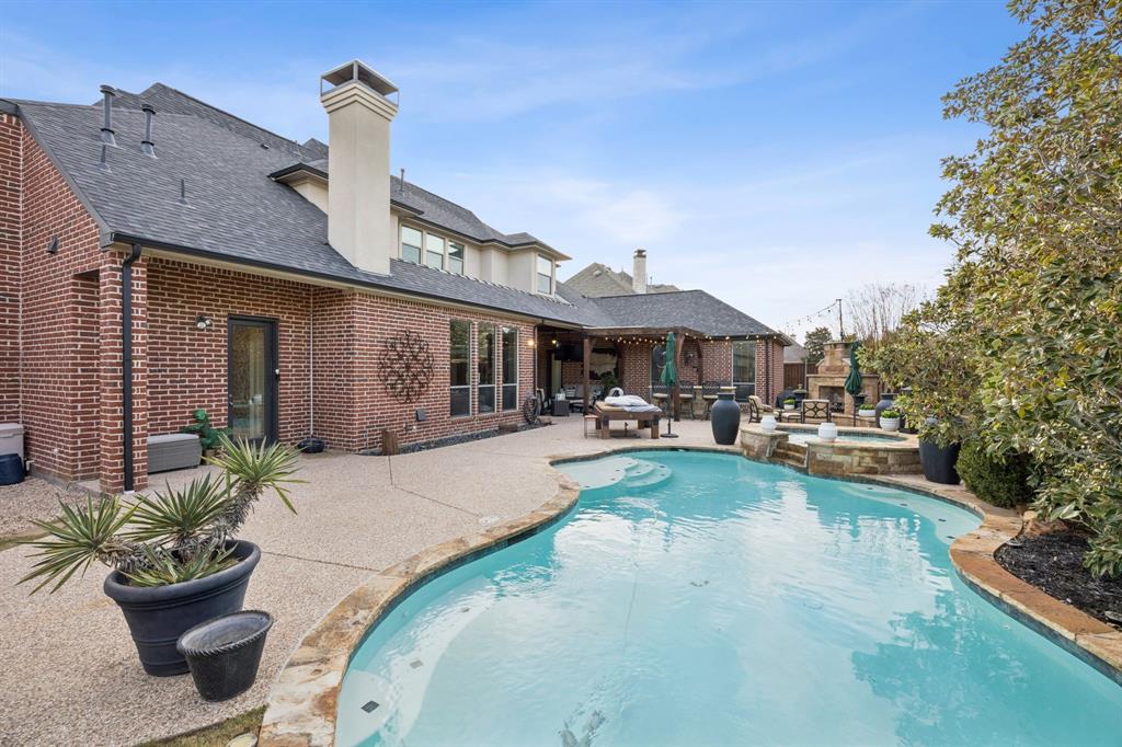 4290 Castle Bank Lane Frisco, TX 75033 - Photo 39 of 40 a view of a house with swimming pool and sitting area