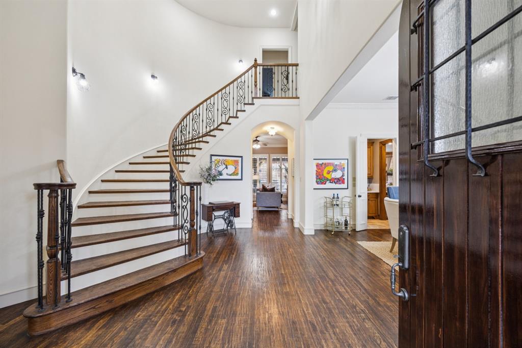 4290 Castle Bank Lane Frisco, TX 75033 - Photo 4 of 40 a view of entryway and hall with wooden floor