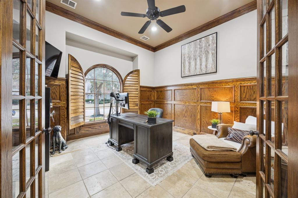 4290 Castle Bank Lane Frisco, TX 75033 - Photo 5 of 40 a living room with furniture a flat screen tv and a large window