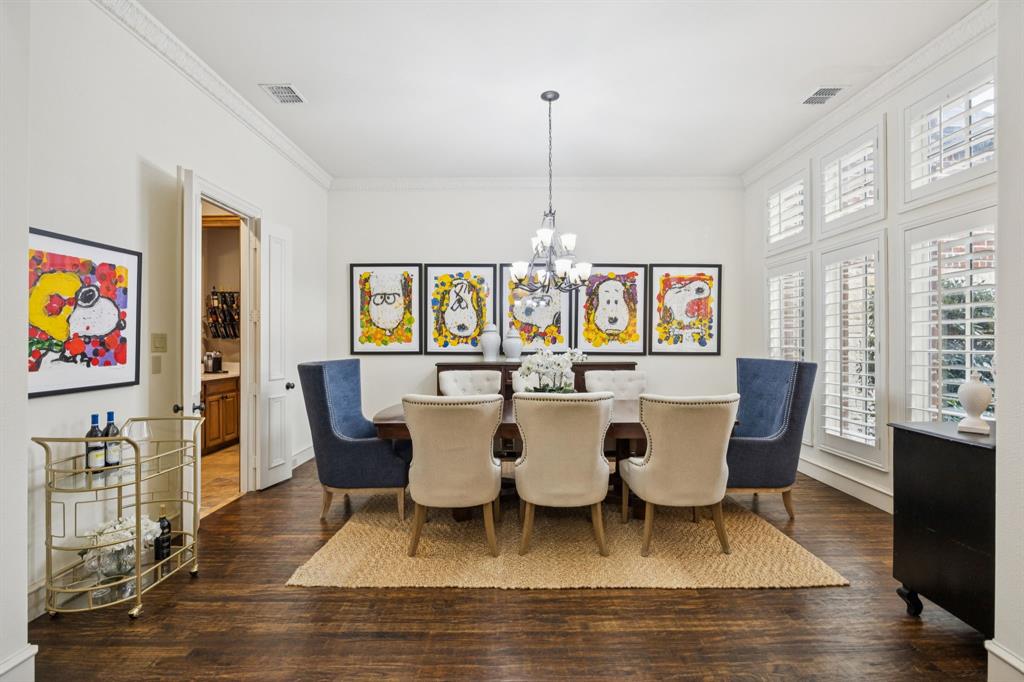 4290 Castle Bank Lane Frisco, TX 75033 - Photo 6 of 40 a dining room with furniture a rug and wooden floor