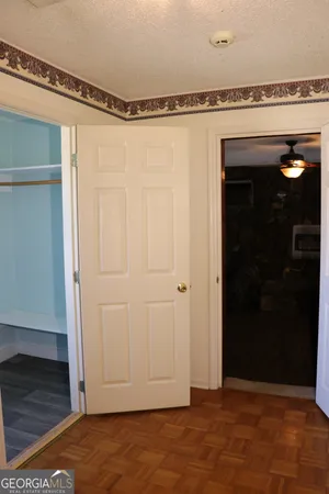 a kitchen with granite countertop a refrigerator stove and sink
