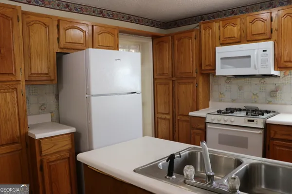 a bathroom with a shower and a sink