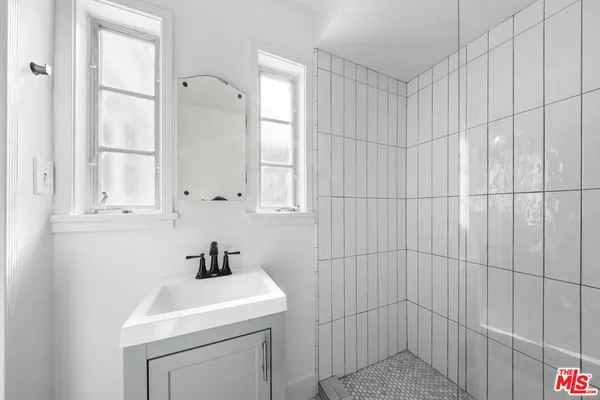 a bathroom with a sink a toilet and vanity