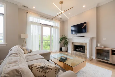 a living room with furniture fireplace and flat screen tv