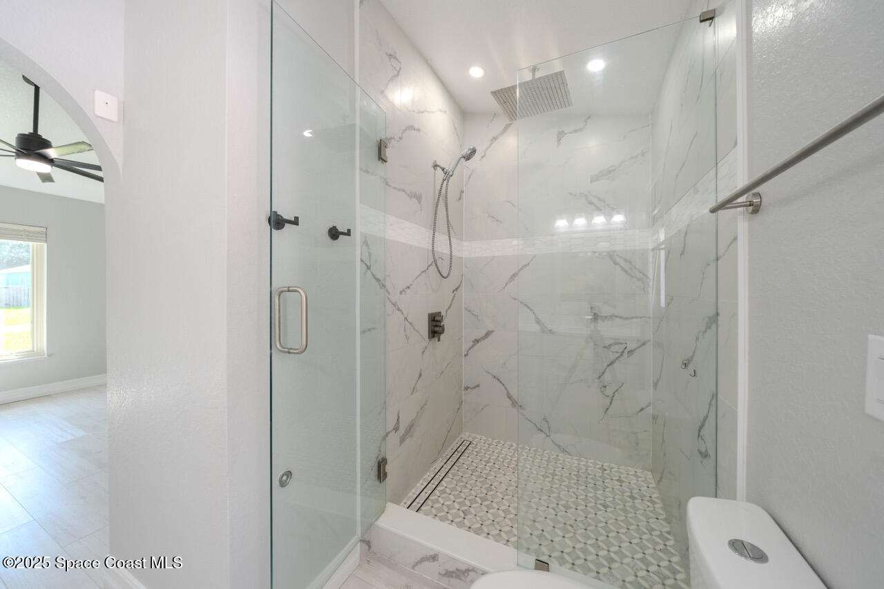 490 Tillman Avenue Southwest Palm Bay, FL 32908 - Photo 20 of 38 a bathroom with a shower