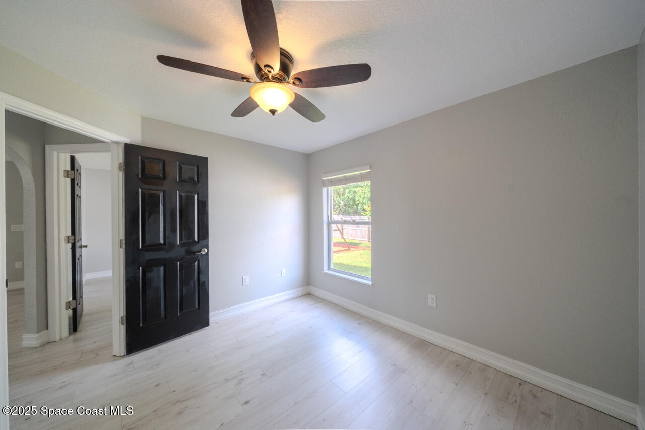490 Tillman Avenue Southwest Palm Bay, FL 32908 - Photo 28 of 38 a view of an empty room with a window