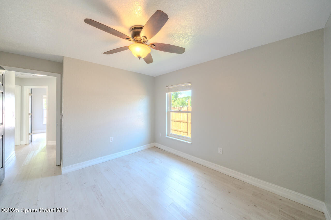 490 Tillman Avenue Southwest Palm Bay, FL 32908 - Photo 29 of 38 a view of an empty room with a window