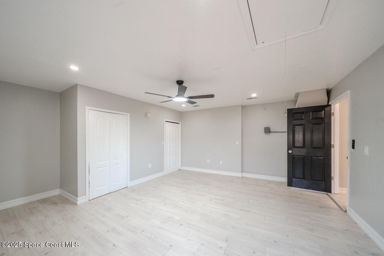 490 Tillman Avenue Southwest Palm Bay, FL 32908 - Photo 30 of 38 a view of an empty room with a kitchen