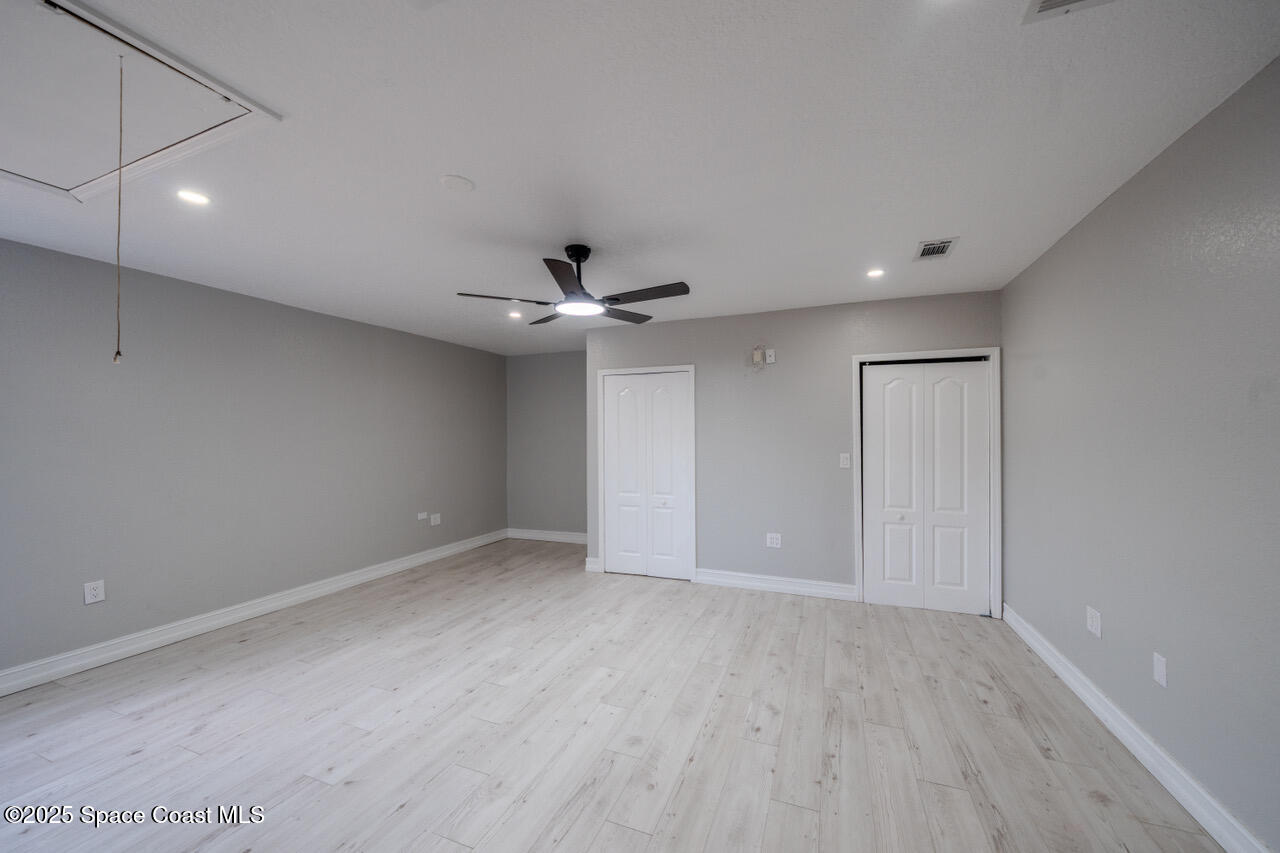 490 Tillman Avenue Southwest Palm Bay, FL 32908 - Photo 32 of 38 wooden floor in an empty room