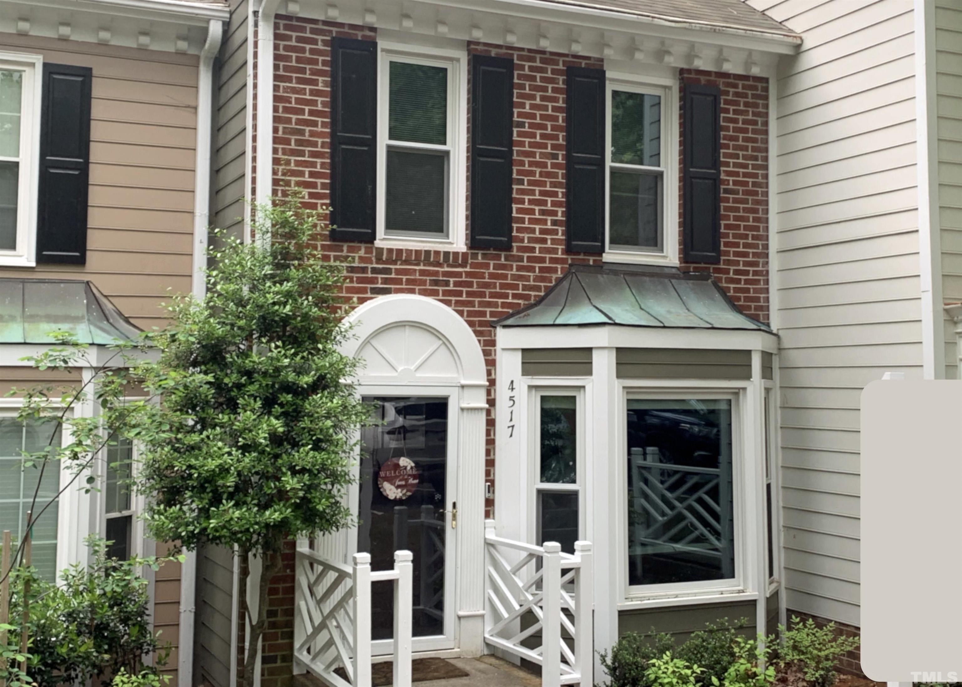 4517 Chinquoteague Court Raleigh, NC 27613 - Photo 1 of 26 a front view of a house with plants
