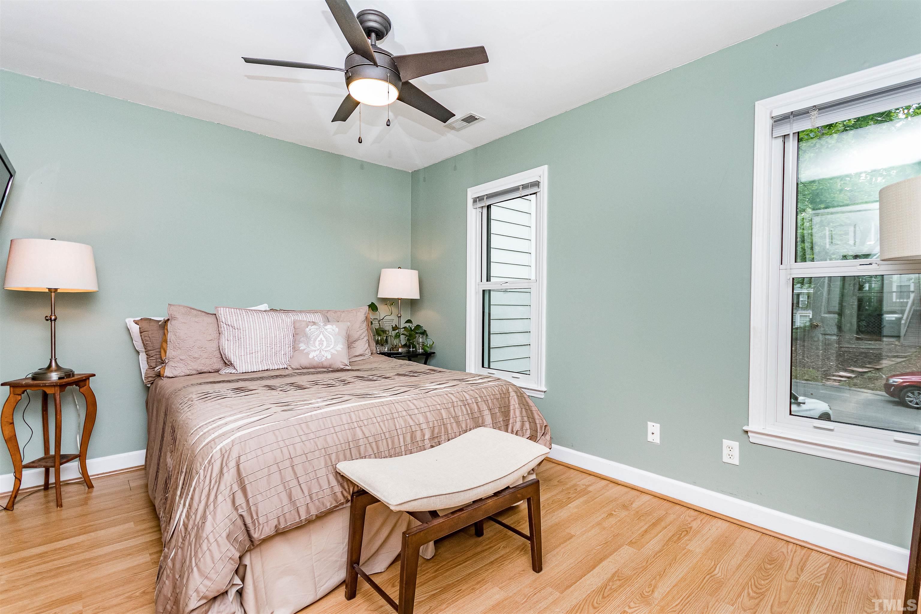 4517 Chinquoteague Court Raleigh, NC 27613 - Photo 15 of 26 a bedroom with a bed and a window