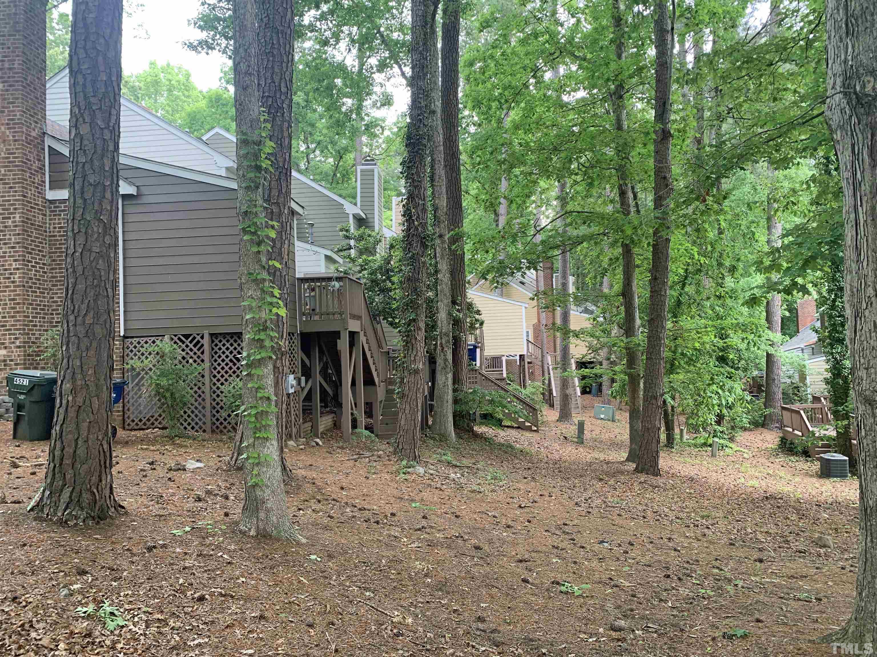 4517 Chinquoteague Court Raleigh, NC 27613 - Photo 3 of 26 a view of a house with a tree in the background
