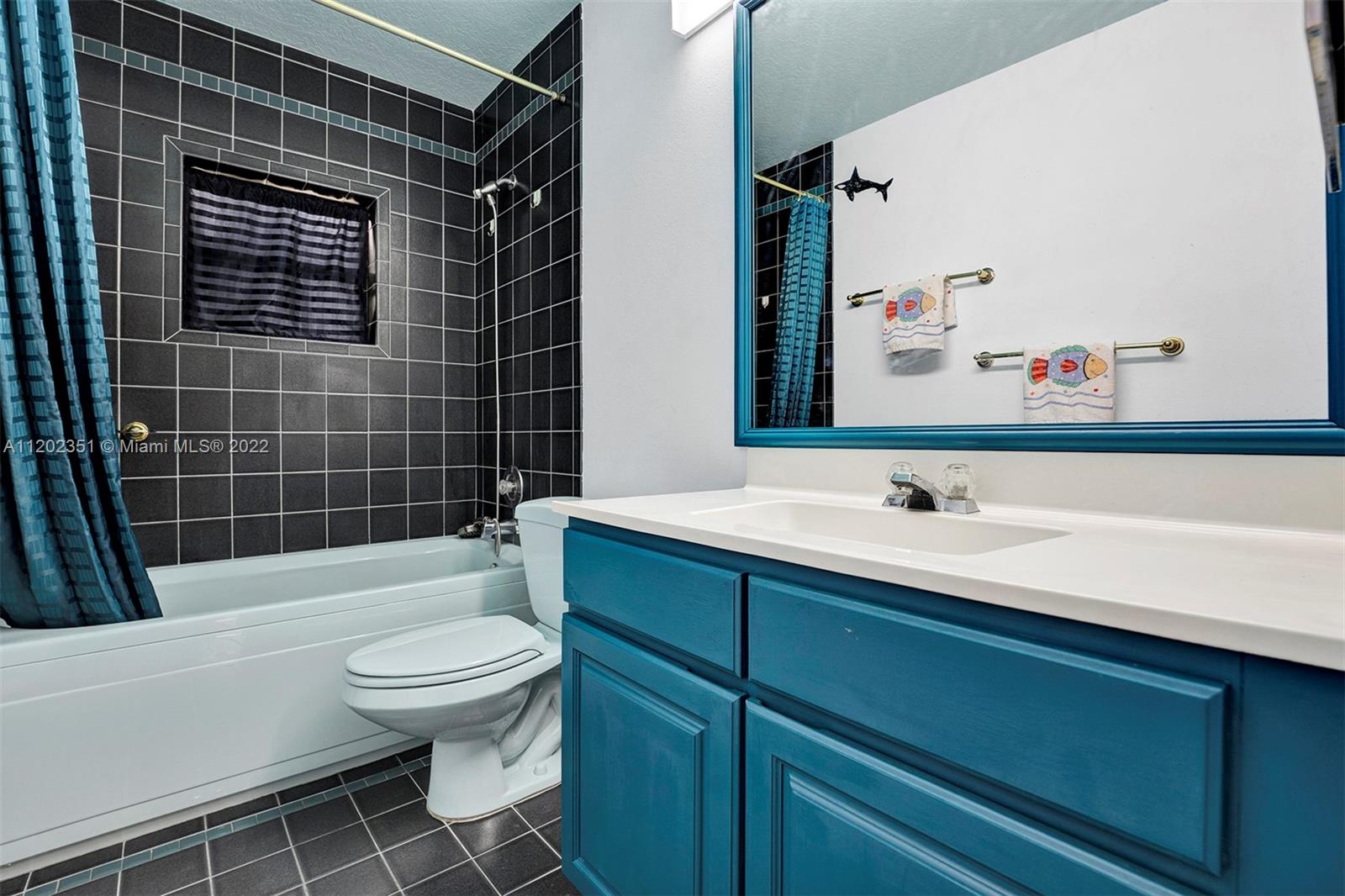 12801 Southwest 148th Street Road Miami, FL 33186 - Photo 19 of 39 a bathroom with a sink toilet and shower