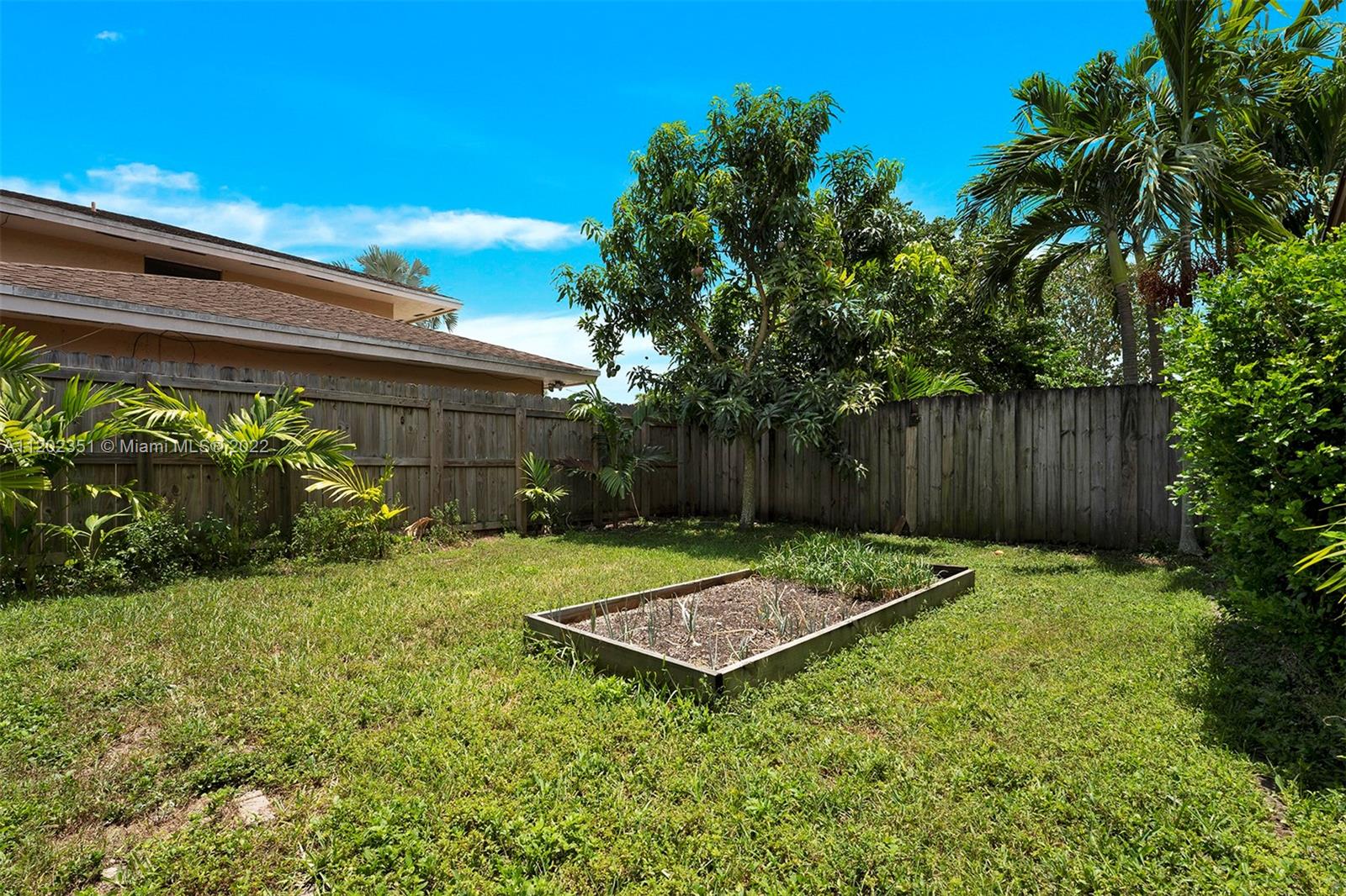 12801 Southwest 148th Street Road Miami, FL 33186 - Photo 31 of 39 a view of a backyard with a patio