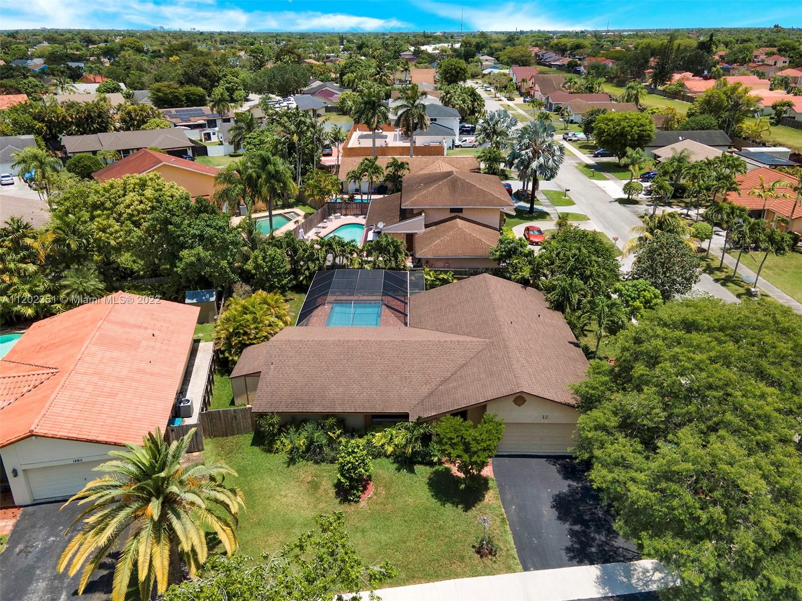 12801 Southwest 148th Street Road Miami, FL 33186 - Photo 35 of 39 an aerial view of a house with garden space and lake view