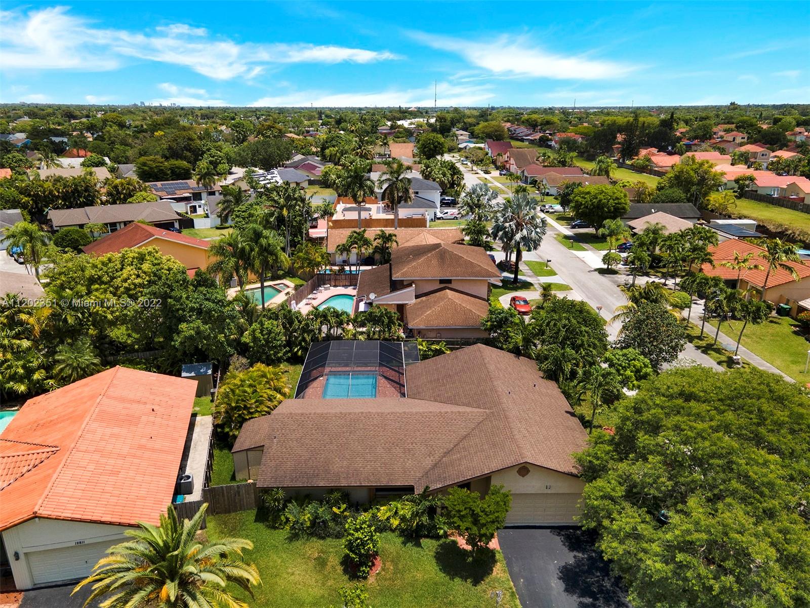 12801 Southwest 148th Street Road Miami, FL 33186 - Photo 38 of 39 an aerial view of a house with yard swimming pool and outdoor seating