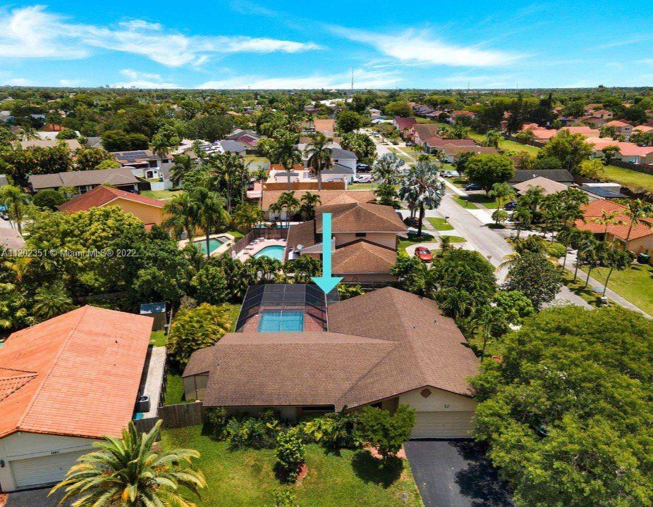 12801 Southwest 148th Street Road Miami, FL 33186 - Photo 39 of 39 an aerial view of a house with a yard and lake view