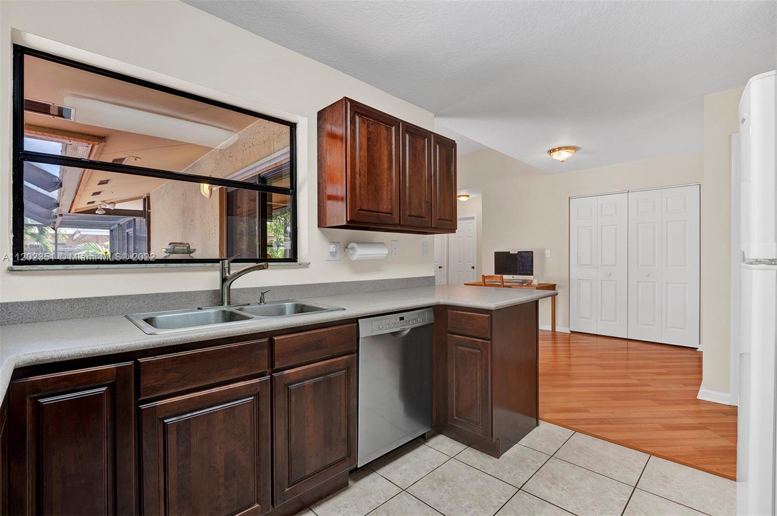 12801 Southwest 148th Street Road Miami, FL 33186 - Photo 7 of 39 a kitchen with a sink and cabinets