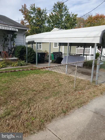 a view of a house with backyard porch and sitting area