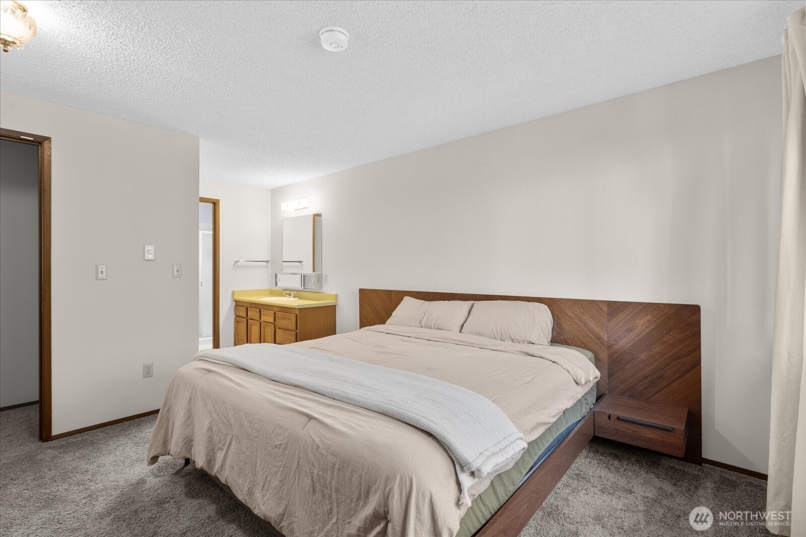 15914 3rd Place Southwest, Unit C Burien, WA 98166 - Photo 15 of 34 a bedroom with a bed and a night stand