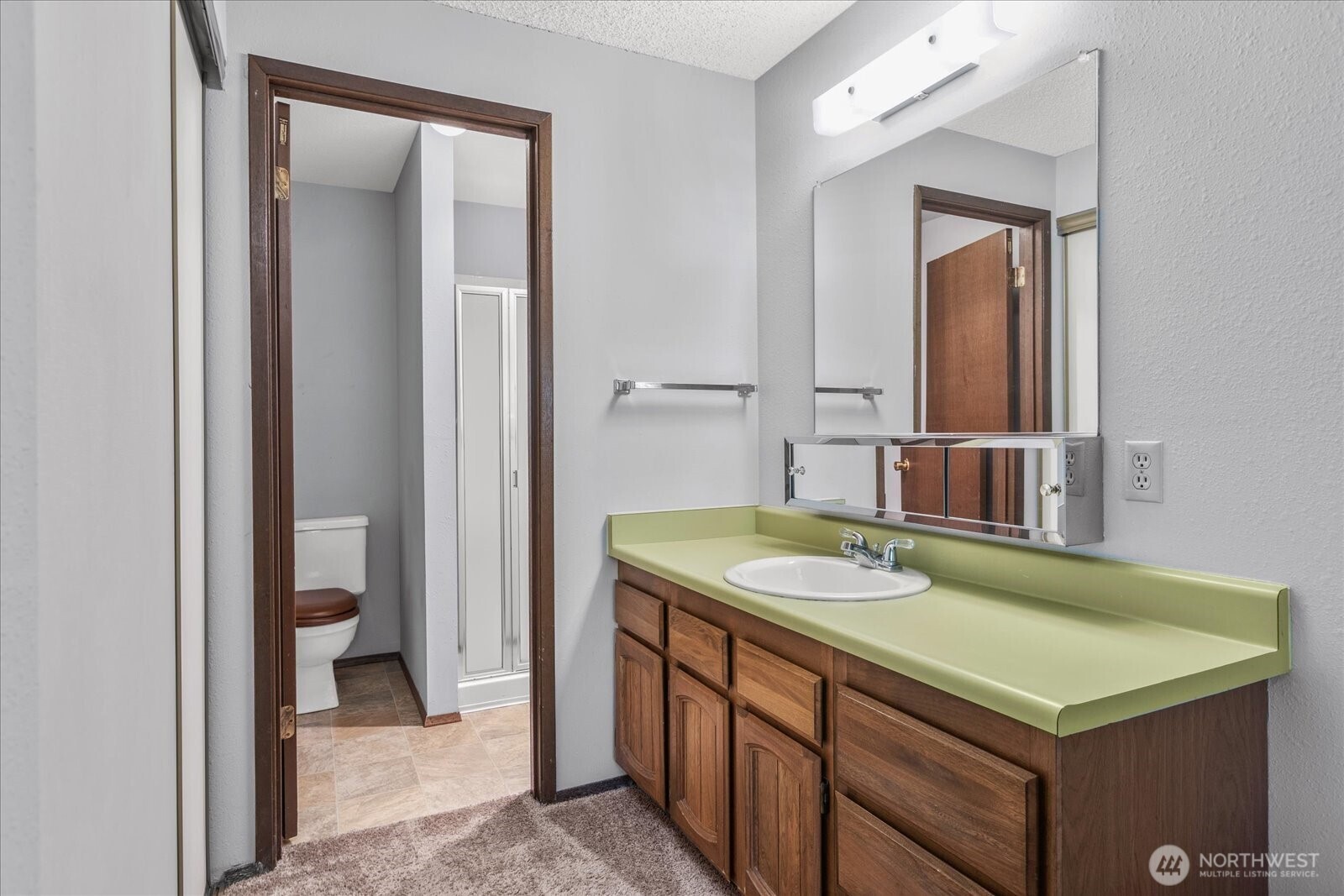 15914 3rd Place Southwest, Unit C Burien, WA 98166 - Photo 16 of 34 a bathroom with a sink and a mirror